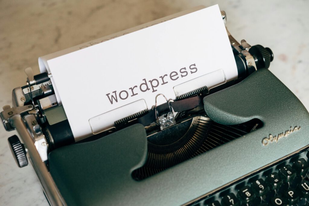 Close-up of a vintage typewriter with paper labeled WordPress.